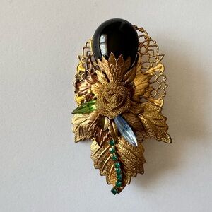 Dona signed vintage brooches
